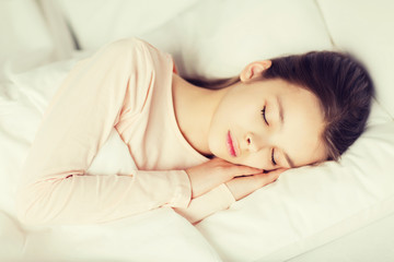 Obraz na płótnie Canvas girl sleeping in bed at home