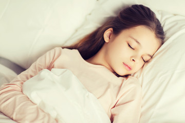 Obraz na płótnie Canvas girl sleeping in bed at home