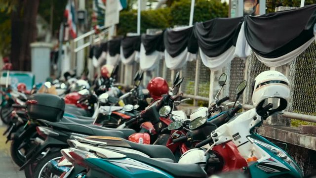 Mopeds stand in a row.