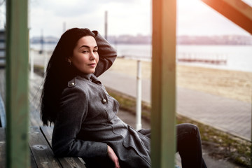 brunette girl relaxing outdoor in the park