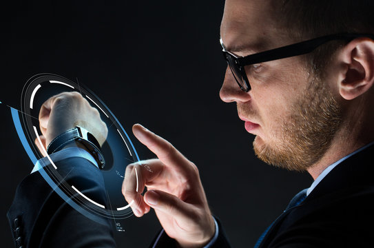 close up of businessman with smartwatch - Powered by Adobe