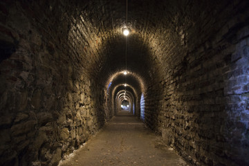 Background of the tunnel from stone and brick walls texture