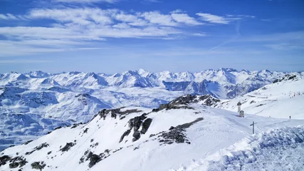Fotobehang Les Menuires ,Alps, France, ski slopes in 3 Valleys winter sport resort, with snowy mountain peaks panorama . © Yols