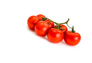 Cherry tomatoes isolated over white background