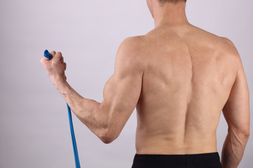 Fototapeta premium Physiotherapy, sport injury rehabilitation treatment with Resistance Band. Osteopathy, Alternative medicine, pain relief concept.