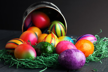 Row of Easter eggs on wooden table
