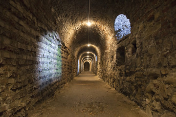 Fototapeta premium Dark corridor walls under ground with natural lights Budapest Castle Hill