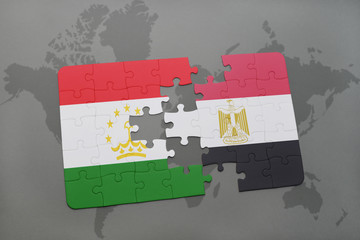 puzzle with the national flag of tajikistan and egypt on a world map