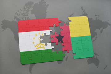 puzzle with the national flag of tajikistan and guinea bissau on a world map