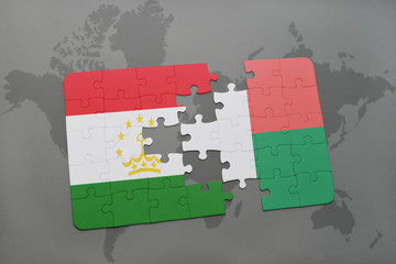 puzzle with the national flag of tajikistan and madagascar on a world map