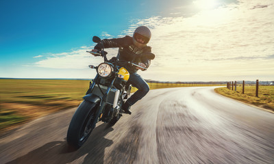 motorbike on the road riding. having fun riding the empty road on a motorcycle tour / journey