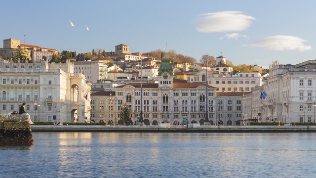 Piazza Unit&agrave; d'Italia square and the Molo Audace, view from the sea of Trieste, Italy
