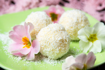 Fototapeta na wymiar Coconut dessert balls on a plate