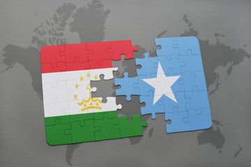 puzzle with the national flag of tajikistan and somalia on a world map