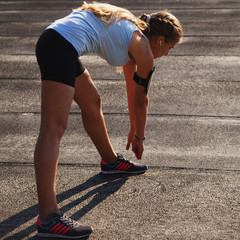 Young fitness woman exercise outdoor (Sports, health, activity concept)