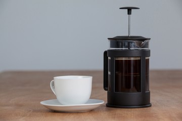 Cafetiere and a cup of black coffee