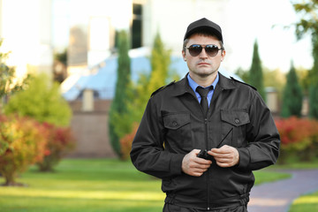 Male security guard in park