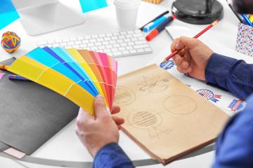 Male designer working in office