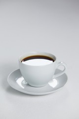 Black coffee served in white cup