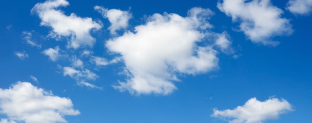 Beautiful white clouds flying against blue sky.