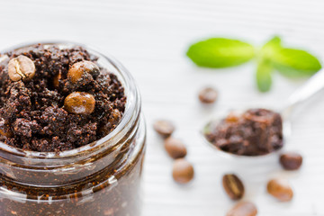 Spa concept with natural coffee scrub on wooden table background