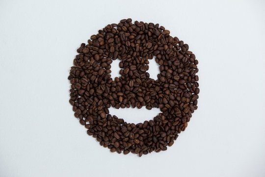 Coffee beans forming smiley face