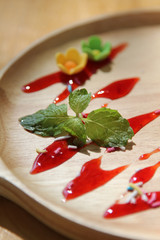Mint leaf on wooden plate.