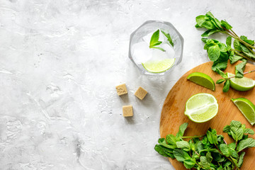 making mojito on stone background top view