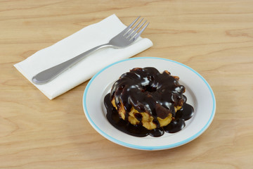 Decadent chocolate breakfast with chocolate frosting covered in chocolate syrup