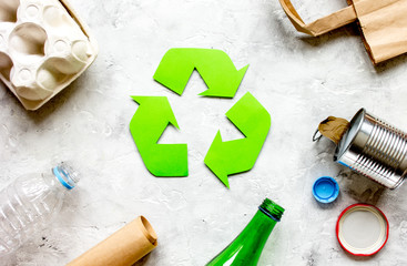 waste and recycling symbol in eco care on stone top view
