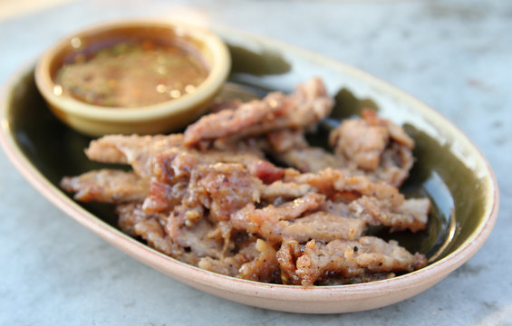 Thai food, deep fried pork with fish sauce.