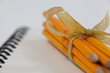 Bunch of pencils wrapped with ribbons