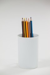 Colored pencils kept in cup