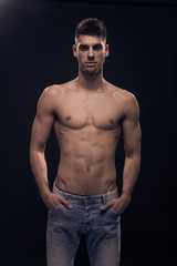 one young man, posing shirtless body, jeans