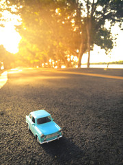 toy car on the road nature background ,vintage filter 