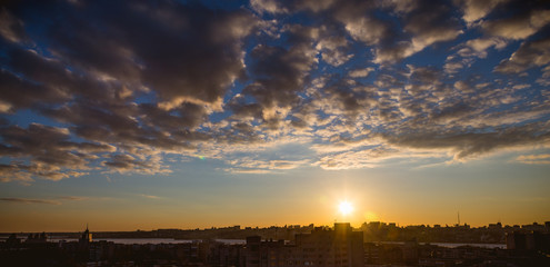 Aerial panoramic ramatic view from rooftop of cityscape in sunset time 