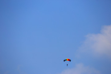 Fototapeta na wymiar parachutes under blue sky, Challenge