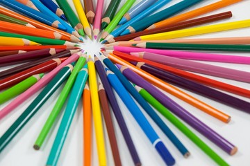 Close-up of colored pencils arranged in a circle