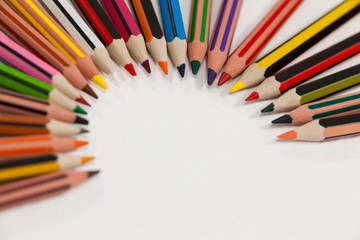 Colored pencils arranged in a semi-circle