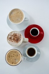 Different types of coffee arranged on white background