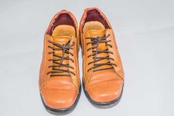 Brown leather shoes with white background