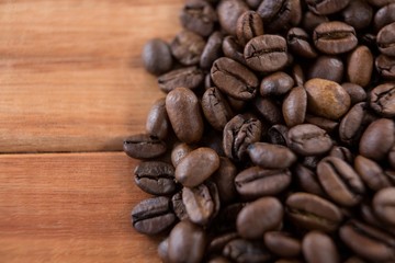 Coffee beans on wooden table