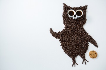 Coffee beans forming owl shape