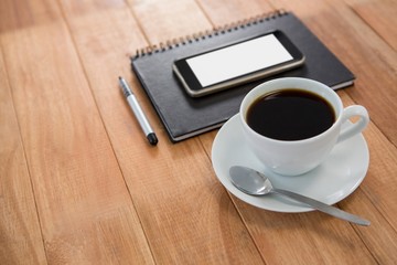 Coffee with organizer and mobile phone