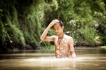 Man playing with water in the river