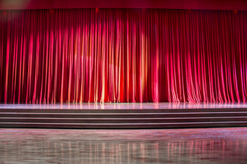 Red curtains and wooden stage. © P Stock