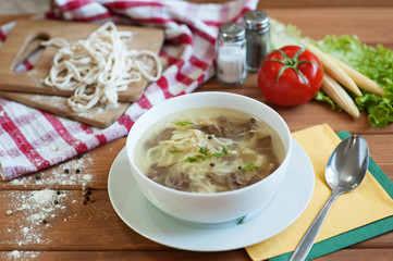 Homemade Chicken Noodle Soup on a wooden table