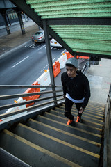 Fototapeta premium A candid portrait of a young hipster entering a Brooklyn subway station