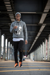 Obraz premium A happy, young, black man smiling off camera in NYC