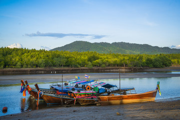 Fototapeta na wymiar Wooden fisherman boats on river in Thailand